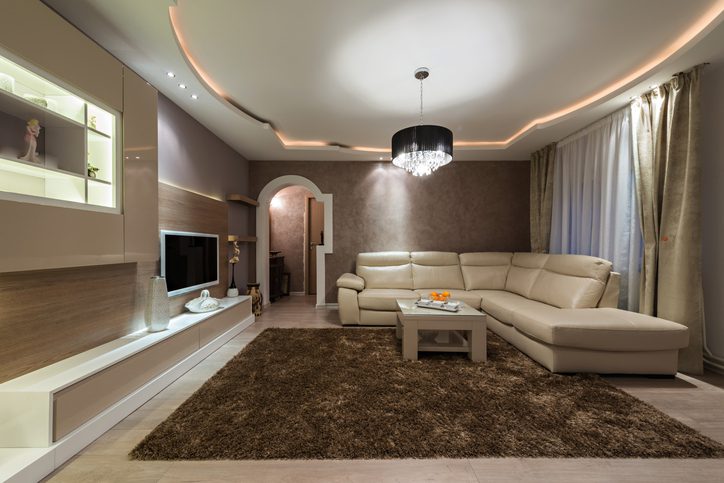 Carolina Electrical Supply Company | sitting room with dark walls, recessed lighting border and a chandelier hanging in the center of the ceiling